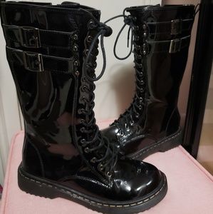 Shiny black tall combat boots